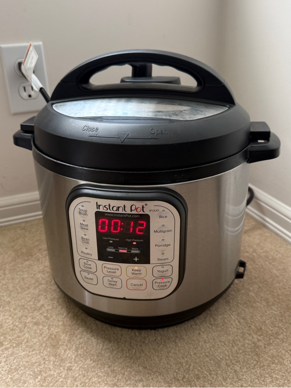 Instant Pot Electric Pressure Cooker in Silver and Black